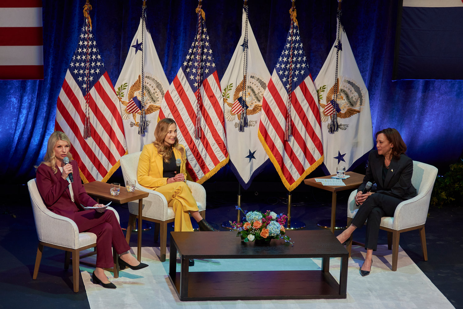 Rep. Brittany Pettersen on stage with Vice President Kamala Harris