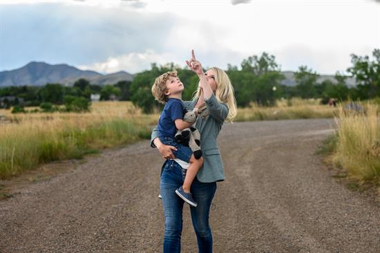 Rep. Pettersen walks through a park with her son in Lakewood