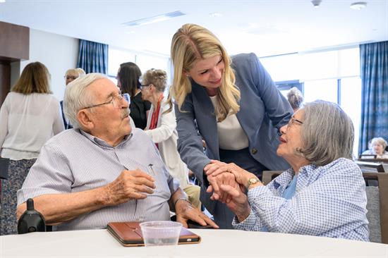 Rep. Pettersen speaks with residents at a senior living facility