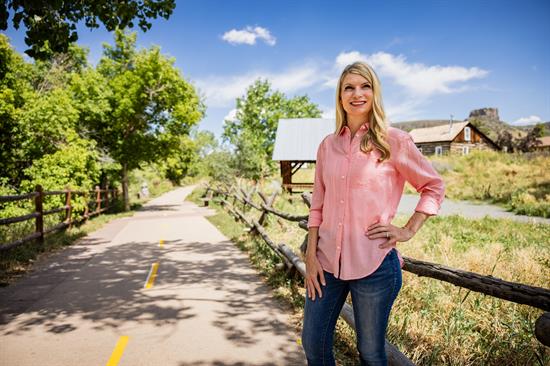 Rep. Pettersen stands on a trail in Golden